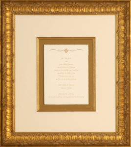 wedding invitation in gold frame