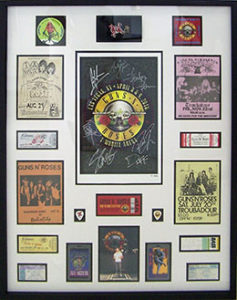 Framed concert tickets, posters, backstage passes and guitar picks