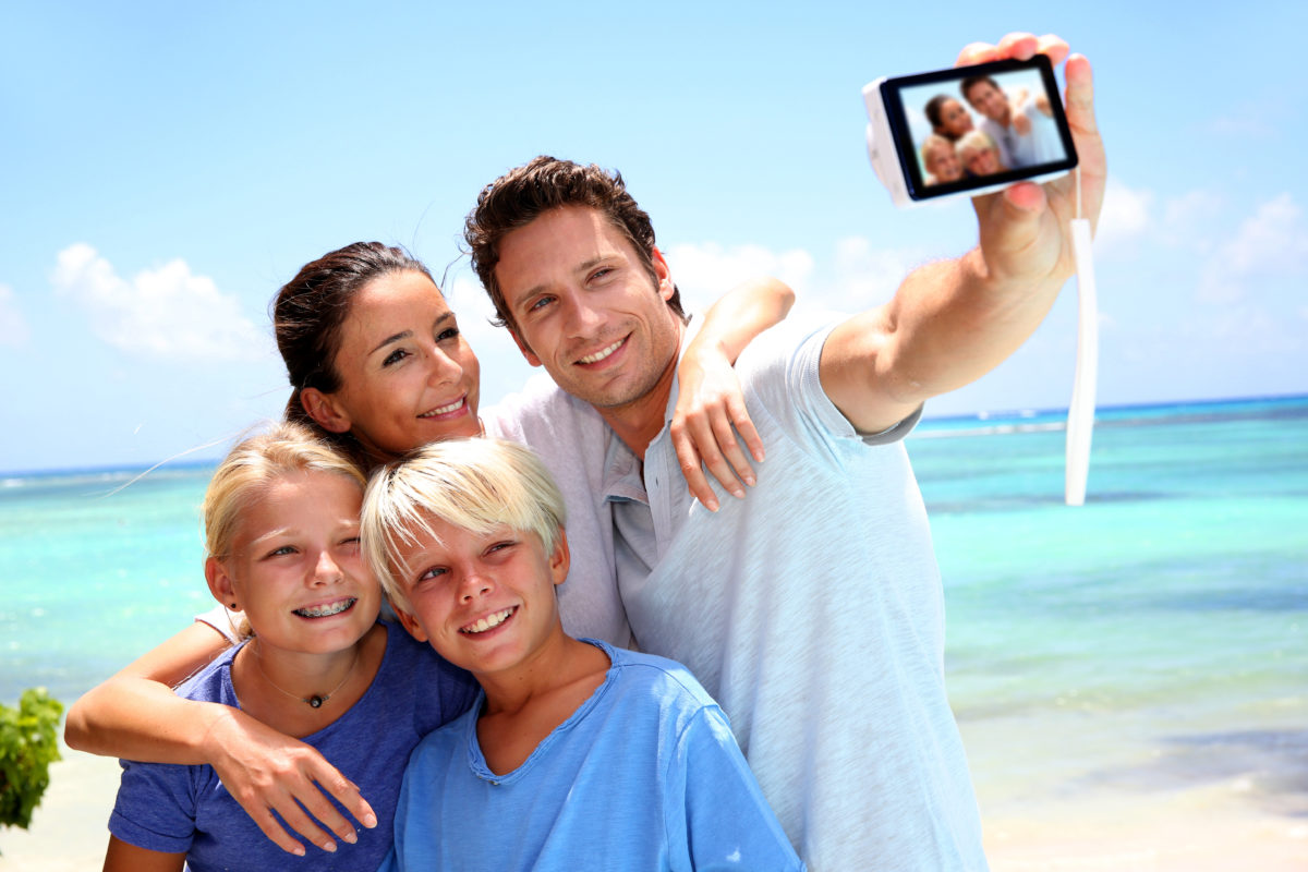 family taking a vacation photo